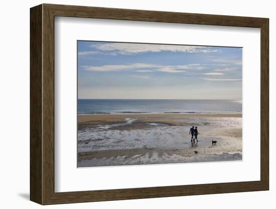 Couple walking dog on North Bay beach, Scarborough, Yorkshire, England, United Kingdom, Europe-Jane Sweeney-Framed Photographic Print