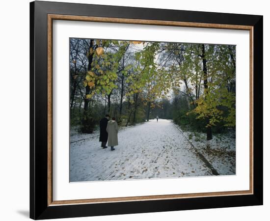 Couple Walking in the Snow in the Tiergarten, Berlin, Germany, Europe-Robert Francis-Framed Photographic Print