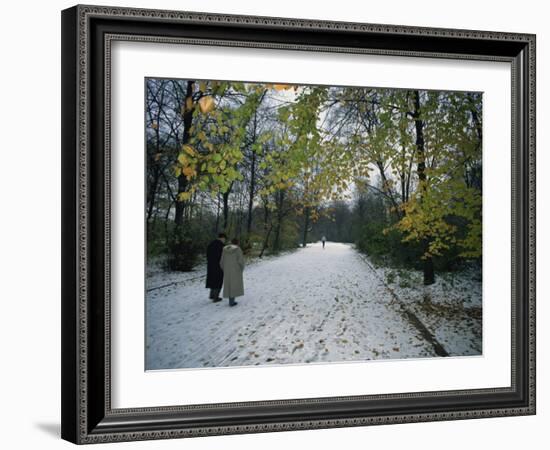 Couple Walking in the Snow in the Tiergarten, Berlin, Germany, Europe-Robert Francis-Framed Photographic Print