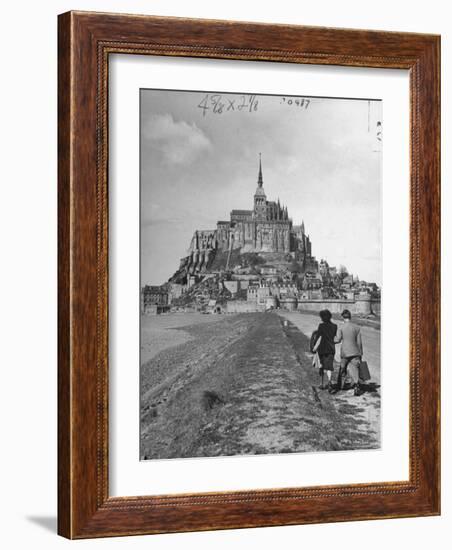 Couple Walking on Causeway Toward Mont Saint Michel-Ralph Morse-Framed Photographic Print