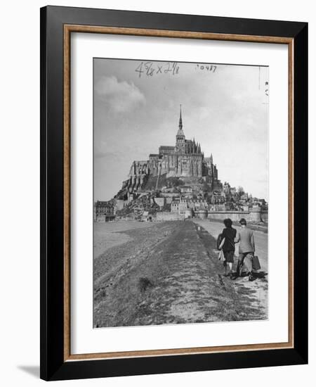 Couple Walking on Causeway Toward Mont Saint Michel-Ralph Morse-Framed Photographic Print