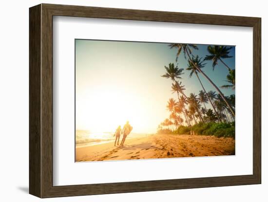 Couple Walking on the Sandy Beach with Palm Trees-Dudarev Mikhail-Framed Photographic Print