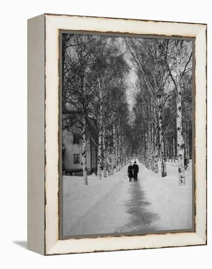 Couple Walking Through a Snow Covered Road-Carl Mydans-Framed Premier Image Canvas