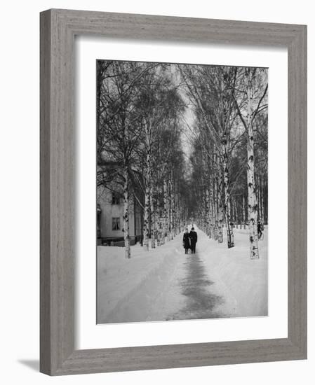 Couple Walking Through a Snow Covered Road-Carl Mydans-Framed Photographic Print