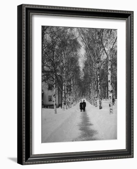 Couple Walking Through a Snow Covered Road-Carl Mydans-Framed Photographic Print