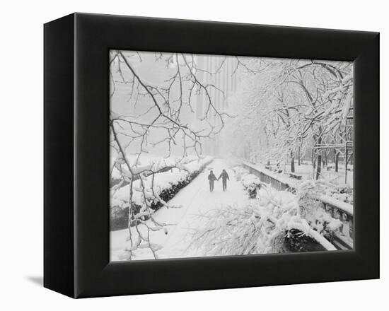 Couple Walking Through Park in Snow-Bettmann-Framed Premier Image Canvas
