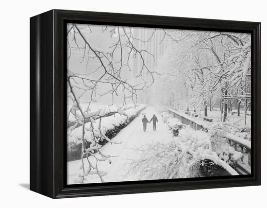 Couple Walking Through Park in Snow-Bettmann-Framed Premier Image Canvas