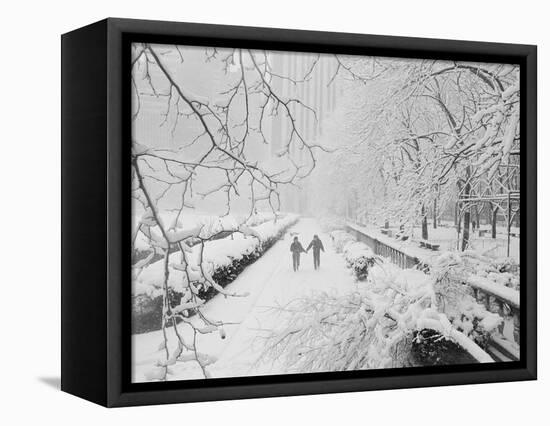 Couple Walking Through Park in Snow-Bettmann-Framed Premier Image Canvas