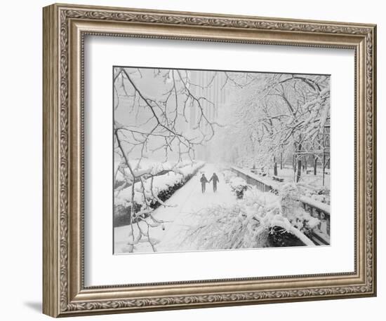 Couple Walking Through Park in Snow-Bettmann-Framed Photographic Print