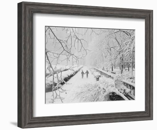 Couple Walking Through Park in Snow-Bettmann-Framed Photographic Print