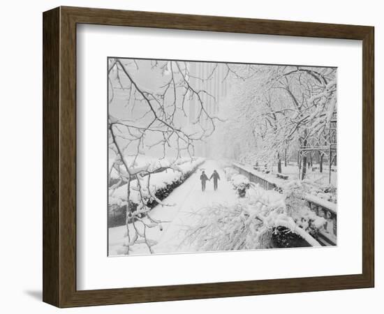 Couple Walking Through Park in Snow-Bettmann-Framed Photographic Print