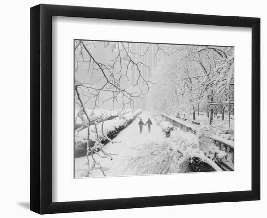 Couple Walking Through Park in Snow-Bettmann-Framed Photographic Print