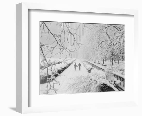 Couple Walking Through Park in Snow-Bettmann-Framed Photographic Print