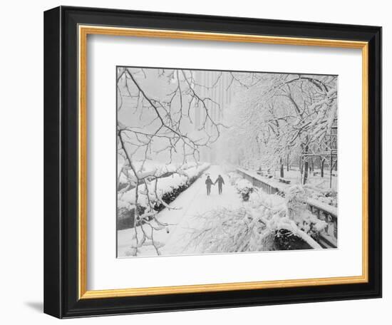 Couple Walking Through Park in Snow-Bettmann-Framed Photographic Print