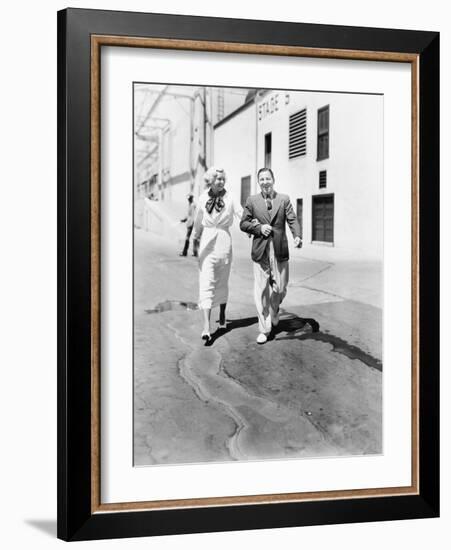 Couple Walking Together and Laughing-null-Framed Photo