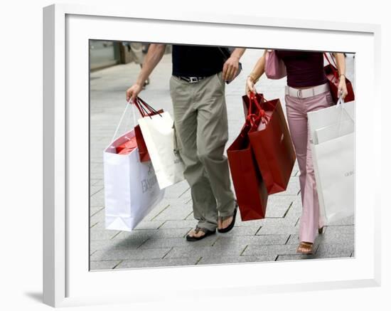Couple Walking with Shopping Bags on Konigsallee, Dusseldorf, North Rhine Westphalia, Germany-Yadid Levy-Framed Photographic Print