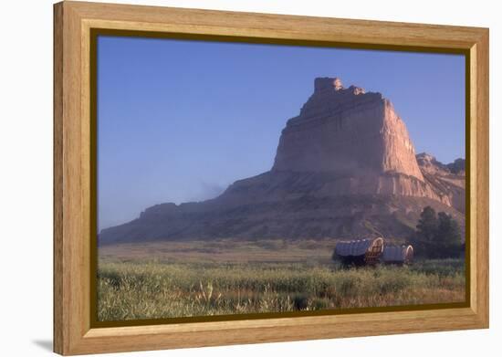 Covered Wagons on the Oregon Trail at Scotts Bluff, Nebraska, at Sunrise-null-Framed Premier Image Canvas