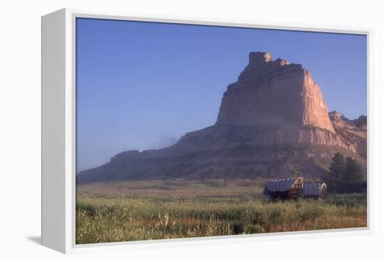 Covered Wagons on the Oregon Trail at Scotts Bluff, Nebraska, at Sunrise-null-Framed Premier Image Canvas
