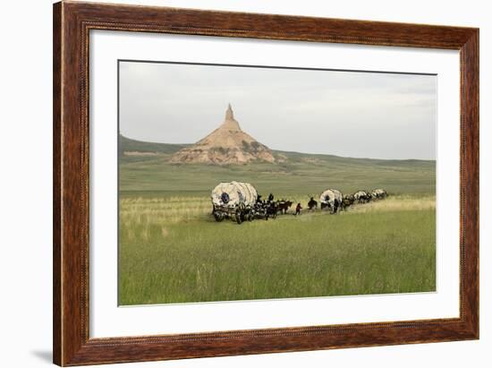 Covered Wagons Passing Chimney Rock, a Landmark on the Oregon Trail, Nebraska-null-Framed Photographic Print