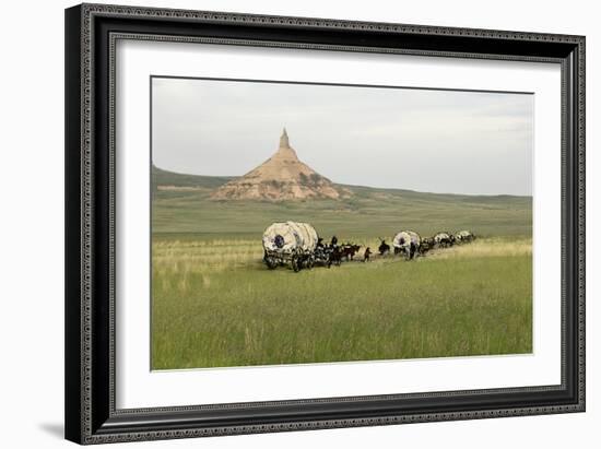 Covered Wagons Passing Chimney Rock, a Landmark on the Oregon Trail, Nebraska-null-Framed Photographic Print