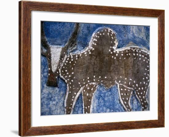 Cow on a Graveyard Headstone near an Oromo village, Ethiopia-Janis Miglavs-Framed Photographic Print