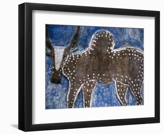 Cow on a Graveyard Headstone near an Oromo village, Ethiopia-Janis Miglavs-Framed Photographic Print