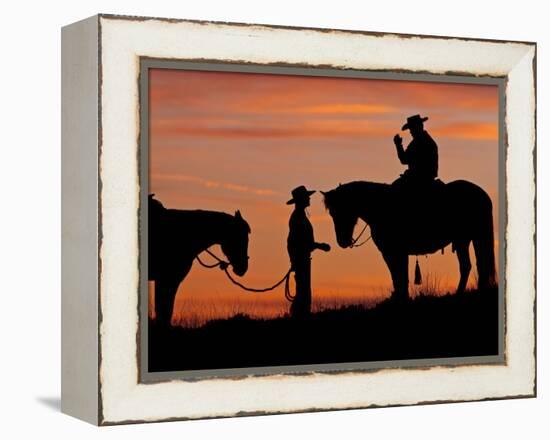 Cowboy and Cowgirl Silhouetted on a Ridge in the Big Horn Mountains, Wyoming, USA-Joe Restuccia III-Framed Premier Image Canvas