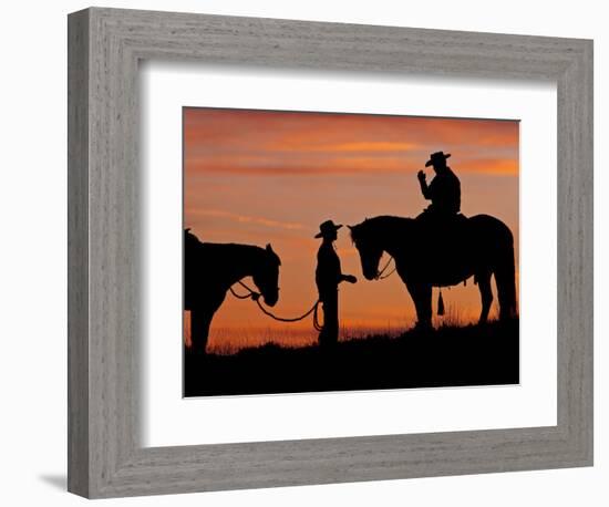 Cowboy and Cowgirl Silhouetted on a Ridge in the Big Horn Mountains, Wyoming, USA-Joe Restuccia III-Framed Photographic Print