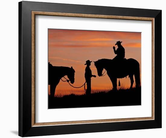 Cowboy and Cowgirl Silhouetted on a Ridge in the Big Horn Mountains, Wyoming, USA-Joe Restuccia III-Framed Photographic Print