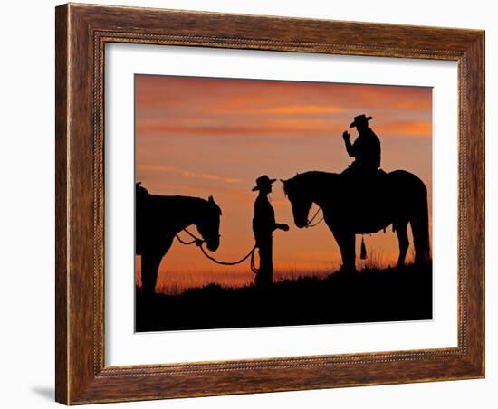 Cowboy and Cowgirl Silhouetted on a Ridge in the Big Horn Mountains, Wyoming, USA-Joe Restuccia III-Framed Photographic Print