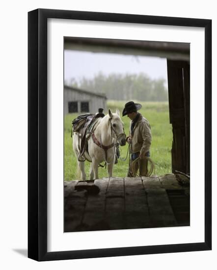 Cowboy and Horse in the Rain, Judith Gap, Montana, USA-Chuck Haney-Framed Photographic Print