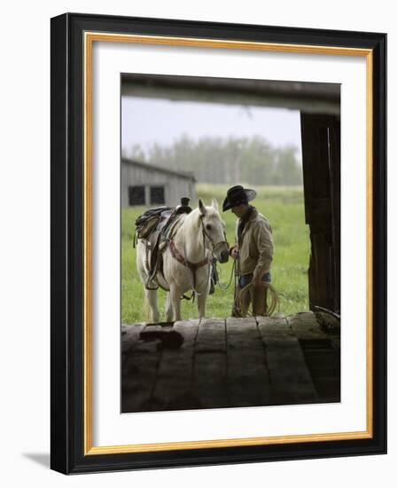 Cowboy and Horse in the Rain, Judith Gap, Montana, USA-Chuck Haney-Framed Photographic Print
