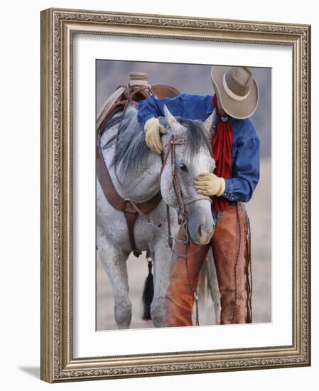 Cowboy Leading and Stroking His Horse, Flitner Ranch, Shell, Wyoming, USA-Carol Walker-Framed Photographic Print