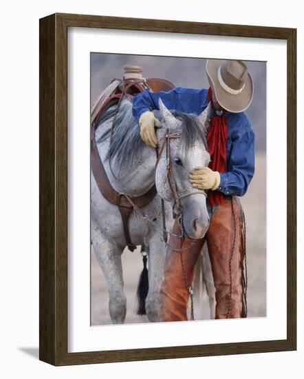 Cowboy Leading and Stroking His Horse, Flitner Ranch, Shell, Wyoming, USA-Carol Walker-Framed Photographic Print