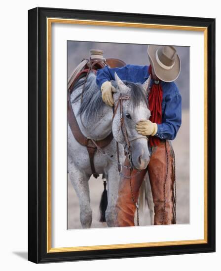 Cowboy Leading and Stroking His Horse, Flitner Ranch, Shell, Wyoming, USA-Carol Walker-Framed Photographic Print