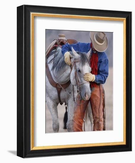 Cowboy Leading and Stroking His Horse, Flitner Ranch, Shell, Wyoming, USA-Carol Walker-Framed Photographic Print
