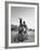 Cowboy Mounting a Horse-Carl Mydans-Framed Photographic Print