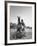 Cowboy Mounting a Horse-Carl Mydans-Framed Photographic Print