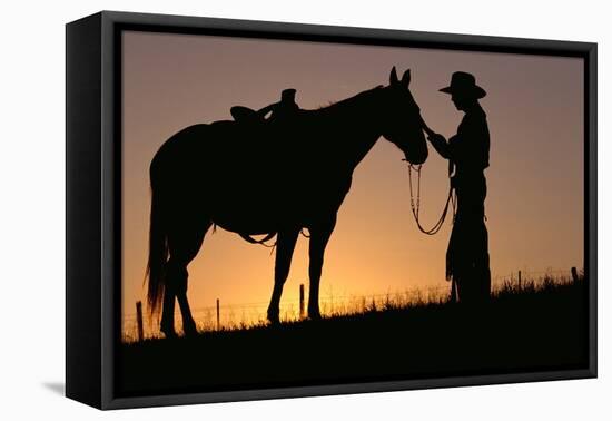 Cowboy Petting Horse at Sunset-Darrell Gulin-Framed Premier Image Canvas