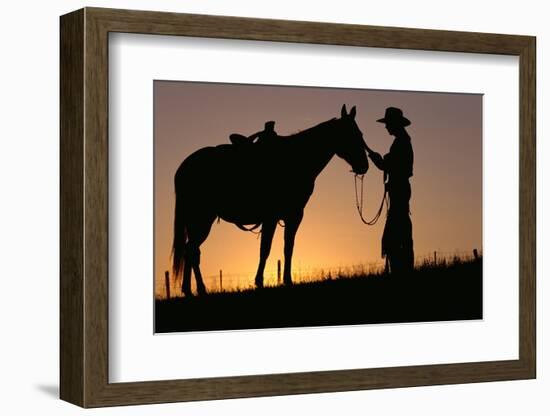 Cowboy Petting Horse at Sunset-Darrell Gulin-Framed Photographic Print