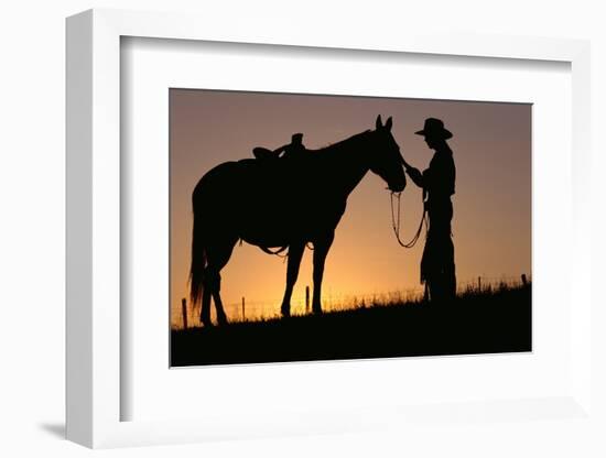 Cowboy Petting Horse at Sunset-Darrell Gulin-Framed Photographic Print