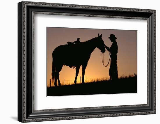 Cowboy Petting Horse at Sunset-Darrell Gulin-Framed Photographic Print