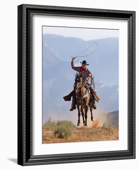 Cowboy Running with Rope Lassoo in Hand, Flitner Ranch, Shell, Wyoming, USA-Carol Walker-Framed Photographic Print