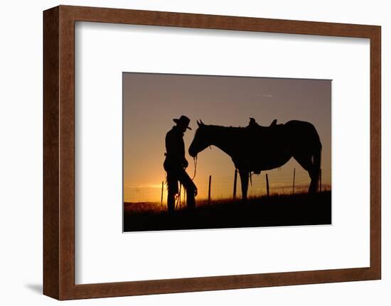 Cowboy Standing with His Horse-Darrell Gulin-Framed Photographic Print