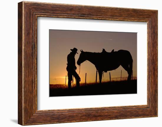 Cowboy Standing with His Horse-Darrell Gulin-Framed Photographic Print