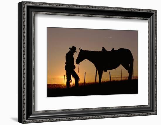 Cowboy Standing with His Horse-Darrell Gulin-Framed Photographic Print