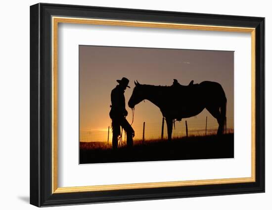 Cowboy Standing with His Horse-Darrell Gulin-Framed Photographic Print