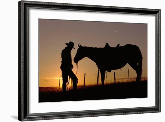 Cowboy Standing with His Horse-Darrell Gulin-Framed Photographic Print