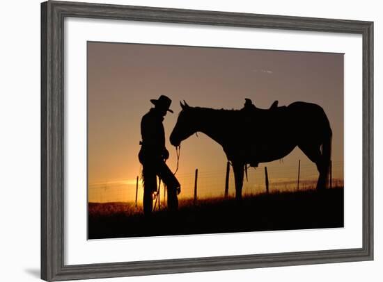 Cowboy Standing with His Horse-Darrell Gulin-Framed Photographic Print