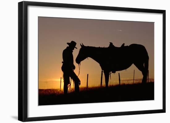 Cowboy Standing with His Horse-Darrell Gulin-Framed Photographic Print